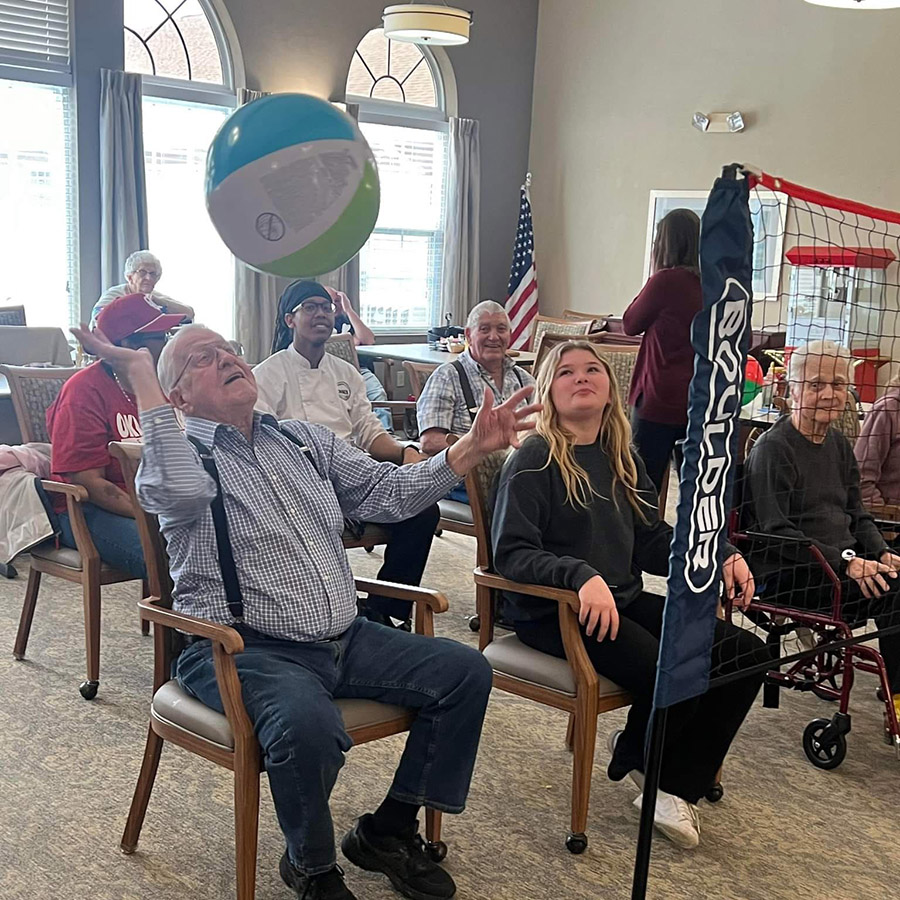 Get ready for some fun! Seniors and employees come together for a game of chair beachball volleyball during Orientation Thursday.