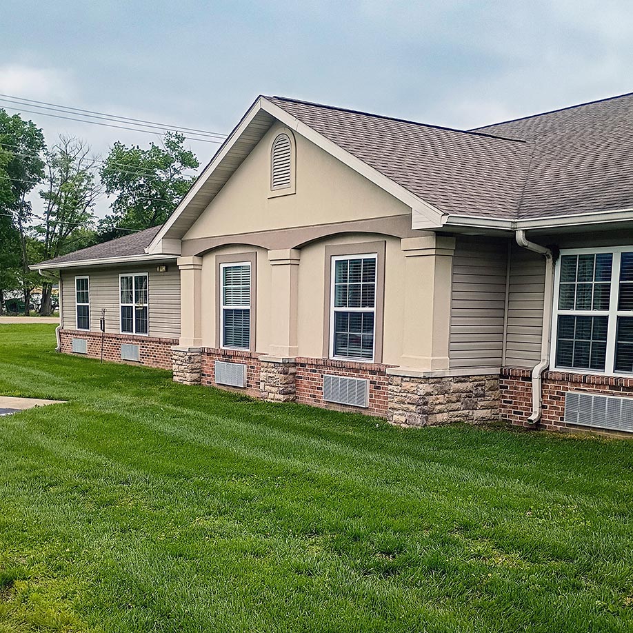 The exterior of Cedar Trails Senior Living showcasing landscaped grounds.